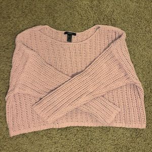 Pink knit sweater.